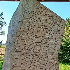 The Rök runestone, its face covered in carved runes